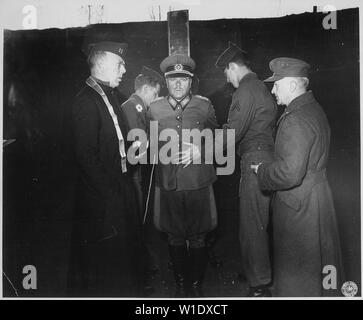 German General Anton Dostler is tied to a stake before his execution by a firing squad in the Aversa stockade. The General was convicted and sentenced to death by an American military tribunal. Aversa, Italy.; General notes:  Use War and Conflict Number 1298 when ordering a reproduction or requesting information about this image.  The scan of this image is flopped (mirrored left-right).  Note the clothing buttoned right side on top like a woman's coat, the captain's bars on the wrong side of the captain's hat, and finally the Army Signal Corps logo in the corner.  If possible, flop it back bef Stock Photo