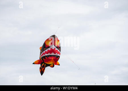 Bedford,Bedfordshire,UK,June 2,2019. Kites flying in the sky among the clouds.Bedford International Kite Festival.