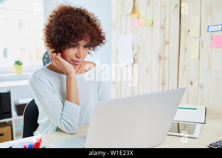 Woman working on laptop Stock Photo