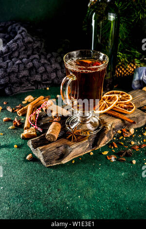 Hot autumn winter drink. Grog, warm tea with spices and dried oranges Stock Photo