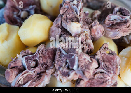 Boiled lamb meat and whole potatoes close up Stock Photo