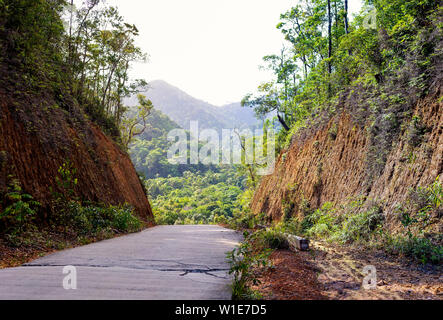 Old concrete road that passes through the gorge, the rural route of Asia. Stock Photo
