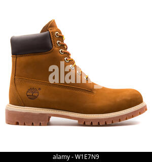 VIENNA, AUSTRIA - AUGUST 25, 2017: Timberland 6in Premium rusty orange boot on white background. Stock Photo
