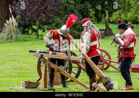 Man in medieval costume with a cannon Stock Photo