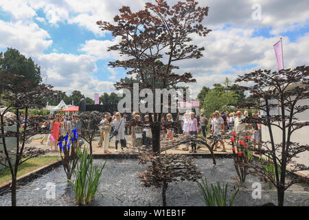 Hampton Court London, UK. 2nd July 2019. Fountain sculpture: Large crowds of visitors enjoying the showgrounds and hundreds of plants exhibits on a sunny day at the RHS Hampton Court garden  festival. Credit: amer ghazzal/Alamy Live News Stock Photo