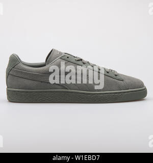 VIENNA, AUSTRIA - AUGUST 7, 2017: Puma Suede Classic agave green sneaker on white background. Stock Photo