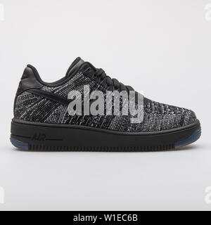 VIENNA, AUSTRIA - AUGUST 7, 2017: Nike Air Force 1 Flyknit Low black and white sneaker on white background. Stock Photo