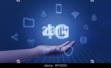 Hand represents 4G. Mobile network concept. Surrounded by icons representing mobile phone services. Stock Photo