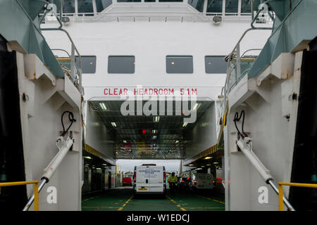 Cars board and park on a Calmac car ferry in Wemyss Bay, Scotland, UK Stock Photo
