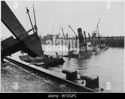 Hamburg, Germany. After the 1943 air raids, the port of Hamburg was strewn with sunken ships, like this Norwegian tramp, which was one of the 2,900 totally destroyed in the port Stock Photo
