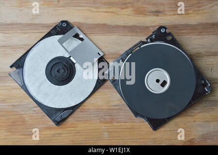 broken floppy disk on wooden board Stock Photo