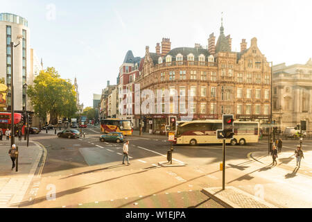 The Strand with the St. Clement Danes, Central Church of The Royal Air Force, in the background on a sunny day, London, England, United Kingdom Stock Photo