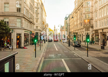 The Strand with the St. Clement Danes, Central Church of The Royal Air Force, in the background on a sunny day, London, England, United Kingdom Stock Photo
