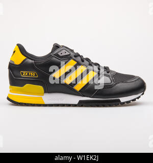 snap Ouderling Ongunstig VIENNA, AUSTRIA - AUGUST 23, 2017: Adidas ZX 750 black and yellow sneaker  on white background Stock Photo - Alamy
