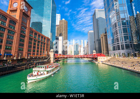 CHICAGO, ILLINOIS -  MAY 10, 2019:  A river tour passes on the Chicago river. Stock Photo