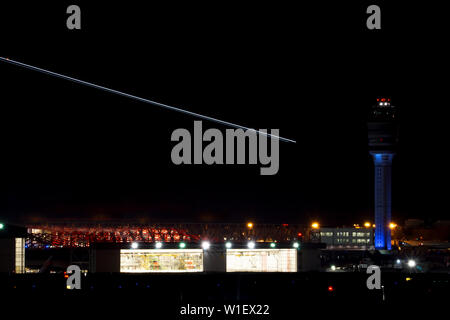 Atlanta, GA / USA : 27. May, 2015 - nightime view of the Atlanta international airport with air traffic control and streaks of planes taking off over