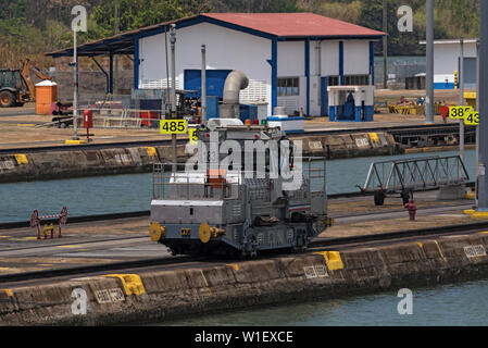 electric locomotive also known as a mule in miraflores locks on panama canal panama city Stock Photo