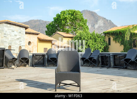 One black chair and table chair leaning on floor Stock Photo