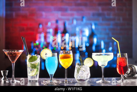 Set with different cocktails on a bar lights background. Stock Photo