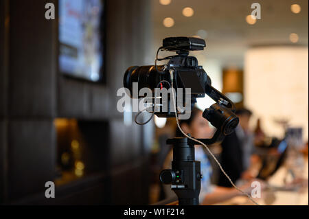 Mirrorless camera with mic wireless on gimbal stabilizer for filming Stock Photo