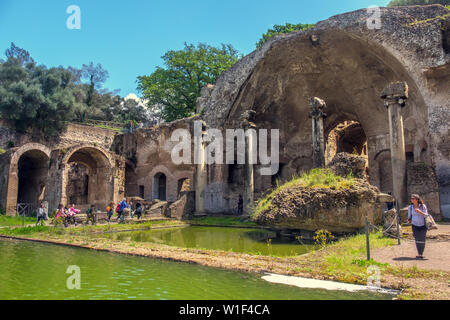 Tivoli Italy tourist woman italian archaeological site Villa Adriana Hadrians Villa Serapeo Canapeo Canopus area pool temple Stock Photo