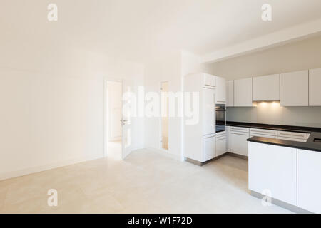 Wide white kitchen in a modern apartment Stock Photo