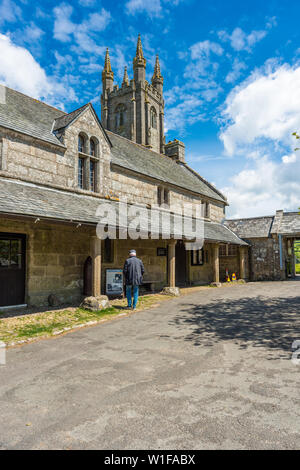 Sextons Cottage and Church House with St Pancras Church at Widecombe in the Moor village in Dartmoor National park, Devon, England, UK. Stock Photo