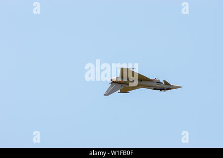 Eurofighter Typhoon upside down at a airshow with a clear blue sky Stock Photo