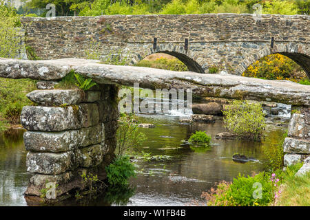 Medieval clapper bridge over the East Dart River at Postbridge on Dartmoor in Devon, West Country, England, UK