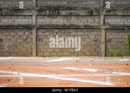 Tele photo shooting old vintage Wall and blur gravel road and Ground for big object background. Stock Photo