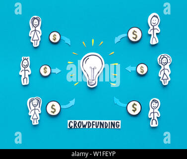 Partial people investing money in new idea on blue Stock Photo