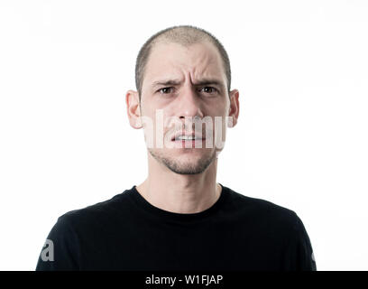 Close up portrait of young man with confused face thinking with a pensive expression looking Puzzled and doubtful. Isolated on white background, in Pe Stock Photo