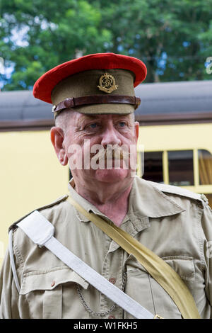 Kidderminster, UK. 29th June, 2019. Severn Valley Railways 'Step back to the 1940's' gets off to a fabulous start this weekend with costumed re-enactors playing their part in providing an authentic recreation of wartime Britain. Portrait of WWII Military Policeman, on duty outdoors, at one of the vintage railway stations. Credit: Lee Hudson Stock Photo