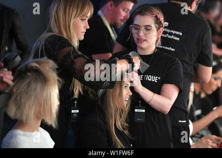 Berlin, Germany. 02nd July, 2019. Models get their hair styled for the show of designer Marc Cain in the Velodrom. The collections for Spring/Summer 2019 will be presented at Berlin Fashion Week. Credit: Jens Kalaene/dpa/Alamy Live News Stock Photo