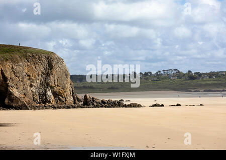 People walking on sandy beach in Brittany, France Stock Photo