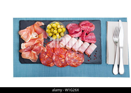 Chorizo, fuet, jamon, salami, bacon, spanish meat antipasto platter. Isolated over white background Stock Photo