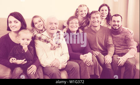 Adults with children are posing for Christmas photos. Stock Photo