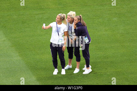England's Rachel Daly, Millie Bright and Georgia Stanway take a selfie on the pitch prior to the FIFA Women's World Cup Semi Final match at the Stade de Lyon. Stock Photo