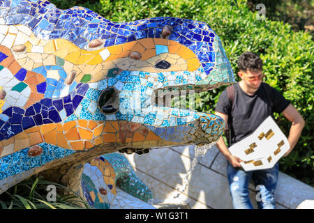 The salamander, or el drac, mosaic ceramic tiling dragon fountain, or lizard fountain, by Antonio Gaudi in Park Guell, Barcelona, Spain Stock Photo