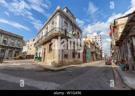 Havana, Cuba - May 14, 2019: Street view of the disadvantaged homes in the Old Havana City, Capital of Cuba, during a bright and sunny day. Stock Photo