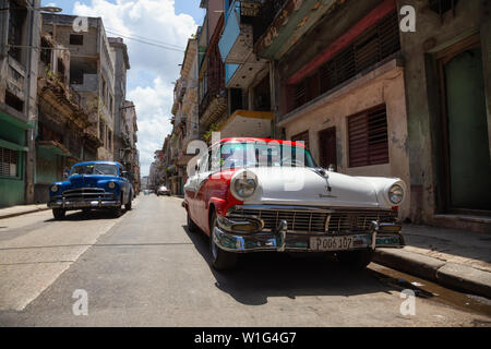 Havana, Cuba - May 19, 2019: Classic Old American Car in the streets of the Old Havana City during a vibrant and bright sunny day. Stock Photo