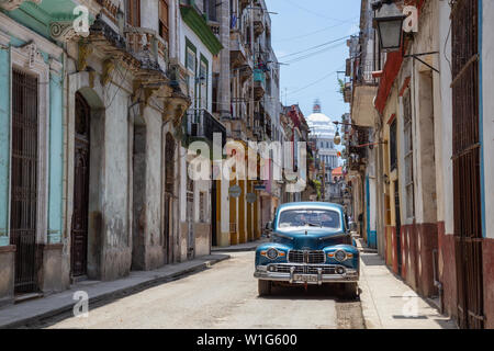 Havana, Cuba - May 19, 2019: Classic Old American Car in the streets of the Old Havana City during a vibrant and bright sunny day. Stock Photo