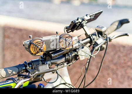 Electric bike handlebar with many modern electronic devices on it. Selective focus on the handlebar Stock Photo