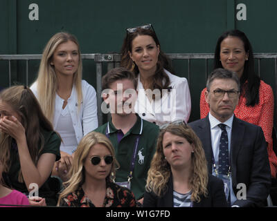 London, UK. 02nd July, 2019. LONDON, ENGLAND - JULY 02: Catherine, Duchess of Cambridge and Anne Keothavong (R) smile as they attend day 2 of the Wimbledon Tennis Championships at the All England Lawn Tennis and Croquet Club on July 02, 2019 in London, England People: Catherine, Duchess of Cambridge, Anne Keothavong Credit: Storms Media Group/Alamy Live News Stock Photo