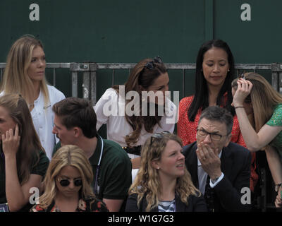 London, UK. 02nd July, 2019. LONDON, ENGLAND - JULY 02: Catherine, Duchess of Cambridge and Anne Keothavong (R) smile as they attend day 2 of the Wimbledon Tennis Championships at the All England Lawn Tennis and Croquet Club on July 02, 2019 in London, England People: Catherine, Duchess of Cambridge, Anne Keothavong Credit: Storms Media Group/Alamy Live News Stock Photo