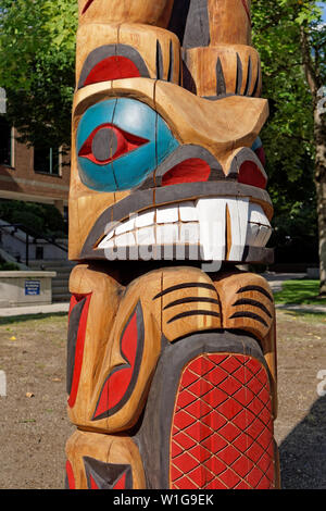 Colorful beaver carving  on the new Coast Salish style Welcome Post outside the Vancouver School Board building, Vancouver, BC, Canada Stock Photo