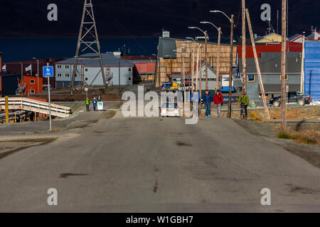 road through longyearbyen, Adventdalen fjord in the background, svalbard, norway Stock Photo