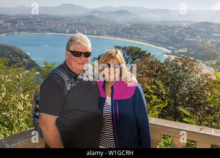 Senior couple traveling around Europe enjoying retirement lifestyle and freedom. In healthy active old people and Europe landmarks and Tourism concept Stock Photo