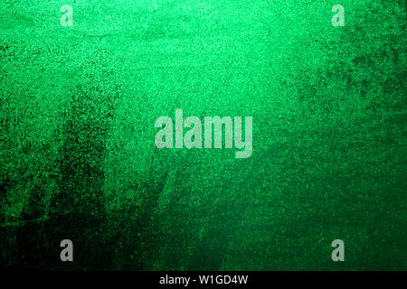 Green water drops on the window background. Background Water droplets shining through the sun closeup. Bright green color background Stock Photo