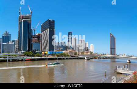 The skyline of the Central Business District (CBD) from Victoria Bridge with CityCat ferry on Brisbane River in foreground, Brisbane, Australia Stock Photo